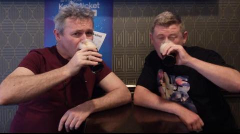 Ciaran and John sharing a pint in an Australian pub