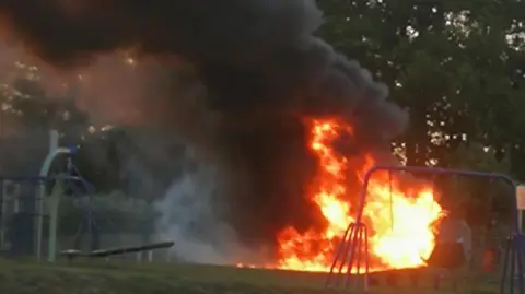 Peter Ellis/Our Bassetlaw Flames licking around play equipment in a park