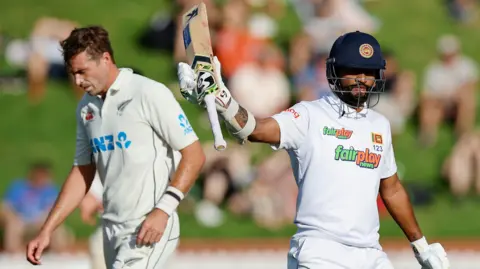 New Zealand's Tim Southee and Sri Lanka batter Dimuth Karunaratne