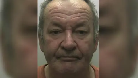 Devon & Cornwall Police A mugshot of Alan Perrin - a grey haired man