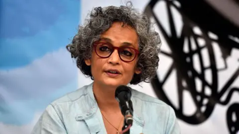NEW DELHI, INDIA - MARCH 10: Author-activist Arundhati Roy addresses a press conference demanding the immediate release of activist Dr GN Saibaba on March 10, 2021 in New Delhi, India. (Photo by Sanjeev Verma/Hindustan Times via Getty Images)