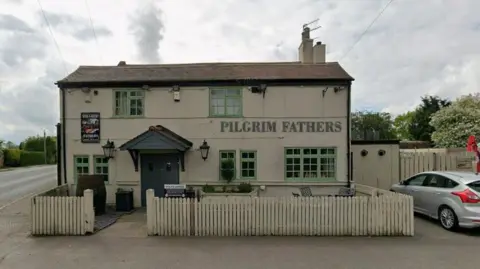 Google Pub with grey sky above