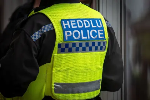 Getty Images A police officers jacket, with the words Heddlu and Police written on it