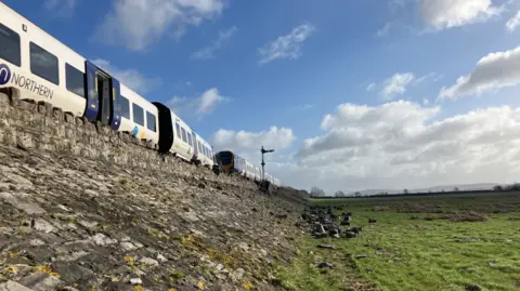 JENNIE DENNETT/BBC Train derailment near Grange-over-Sands