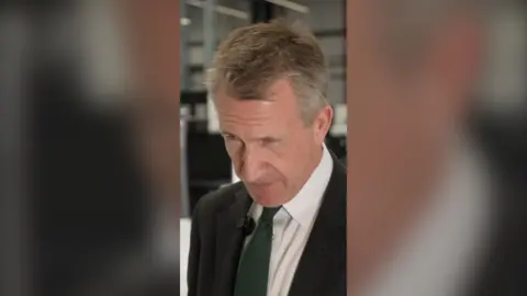 Dan Jarvis in a suit.