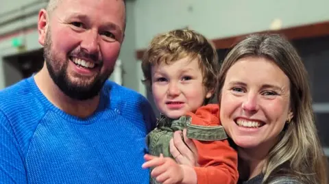 Keep Me Breathing James Oakley and Stephanie Roberts, with son Casper who has CCHS