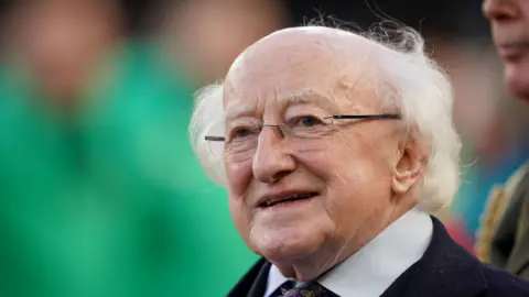 PA Media A close up imagine of Ireland's President Michael D Higgins. He is wearing a suit and glasses.