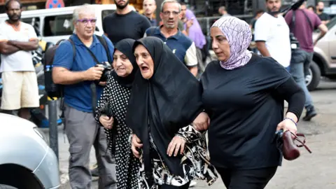 EPA Friends and relatives of injured people arrive at the American University of Beirut Medical Center (AUBMC) in Beirut, Lebanon (17 September 2024)