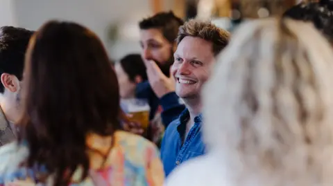 CLICK Click club attendees socialising 