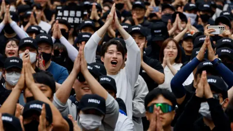 Reuters Members of the National Samsung Electronics Union at a rally in Seoul, South Korea, on May, 2024.