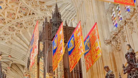 College of St George Prince Andrew's banner was hanging second from the left in this row
