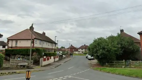 The entrance to King Edward Road, a residential street made up of semi-detached and terraced houses.