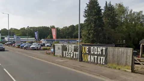 Google There had been opposition from some Sprowston residents to plans for a McDonald's in Mousehold Lane, as pictured by this neighbour's sign stating "you keep it, we don't want it" using the company's logo.