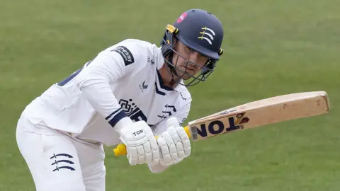 Leus du Plooy plays a shot for Middlesex against Northamptonshire at the County Ground in April 2026.