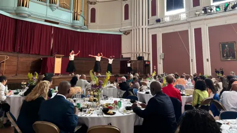 Honor Morgan/BBC People attending a Windrush Stories and Caribbean Tea Party in Cambridge