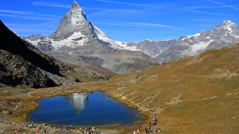 Andia/Universal Images Group The Matterhorn and Lake Riffelsee near Zermatt, in the canton of Valais in Switzerland