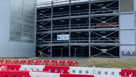 The Terminal Car Park One has been blocked off by red and yellow fences as well as thinner metal fences. 