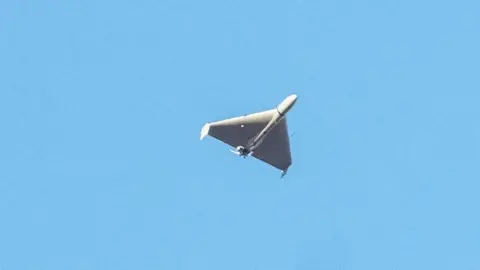 Reuters An Iranian-made Shahed drone in flight in Ukraine