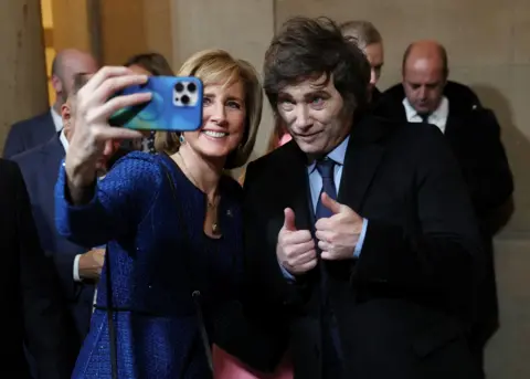 Reuters U.S. Representative (R-NY) Claudia Tenney and Argentina's President Javier Milei pose for a selfie