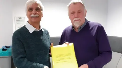 LDRS Kabul Sandu and Peter O'Rourke with petition