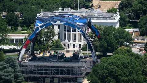 AFP via Getty Images a massive domed, open-air structure being built next to the White House