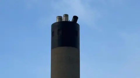 ANNEKA COLLINS The power stack, which has three prongs, the right one is falling off.