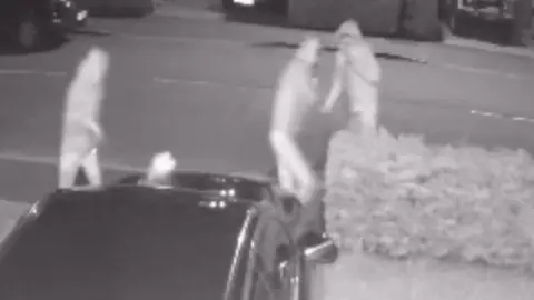 Anonymous resident CCTV of youths throwing a rock at a car in Haxby