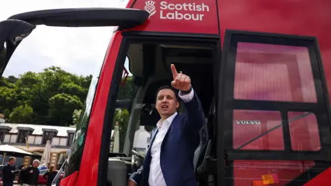 Getty Images Anas Sarwar on Labour's campaign bus