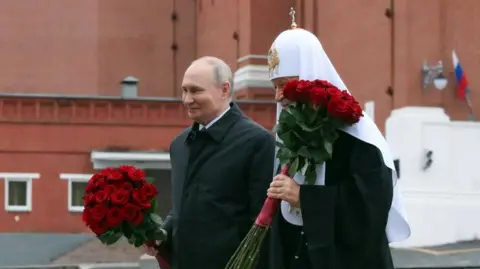 SPUTNIK/KREMLIN POOL/EPA/Shutterstock Russian President Vladimir Putin (L) and Patriarch Kirill of Moscow and All Russia take part in a flower-laying ceremony