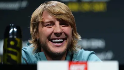 Paddy Pimblett laughs at a news conference