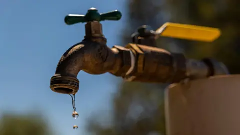 A dripping tap outdoors.