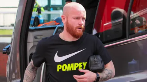 Connor Ogilvie leaves the Portsmouth team bus
