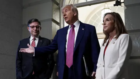 U.S. President Donald Trump, U.S. House Speaker Mike Johnson (R-LA) and House Republican Conference Chair Lisa McClain (R-MI) speak to members of the media