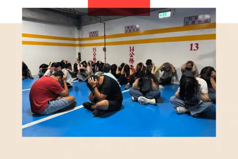 How Taiwan is preparing for a China attack with acting, fake blood and fake missile attacks 54 Tessa Wong/ BBC People in Kinmen with their hands over the heads sitting on the floor, as part of one of the drills