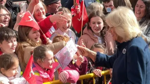 BBC Queen Camilla greeting the crowds