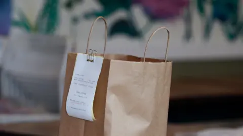 A take-out order is ready for pickup at Cassava restaurant on Balboa Street in San Francisco, Calif on Wednesday, April 8, 2020. 