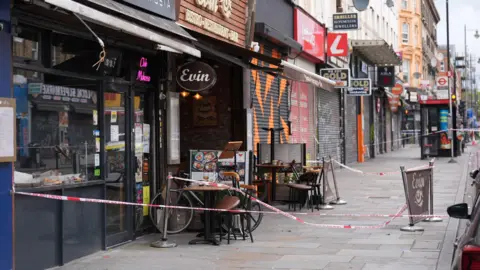 PA Media Restaurant where the girl was sitting outside in the days after with police cordon up and table and chairs stacked outside