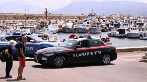 Getty Images An Italian police car at a port in Sicily 