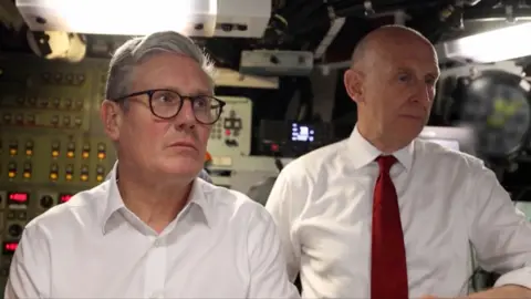 Keir Starmer and John Healey in control room of submarine 