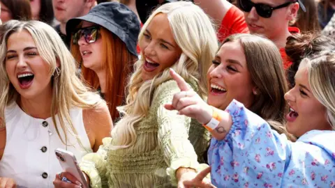 Getty Images Female fans enjoy the music at TRNSMT