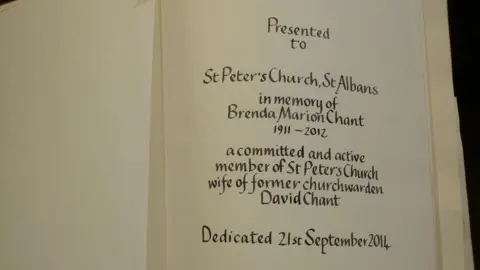 Hertfordshire Police A bible opened at the first page, revealing the inscription "Presented to St Peter's Church, St Albans, in memory of Brenda Marion Chant, 1911-2012, a committed and active member of St Peter's Church, wife of former churchwarden David Chant. Dedicated 21st September 2014."