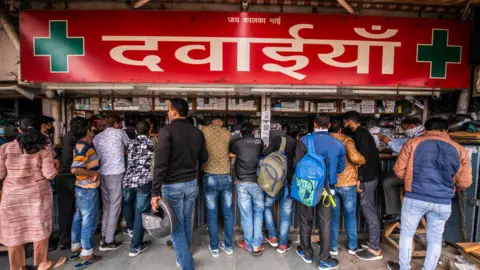 Getty Images  People rush to buy masks, hand sanitizers and medicines at pharmacy shop, AIIMS, on March 5, 2020 in New Delhi, India. 