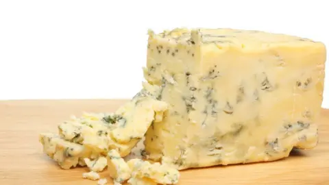 Thinkstock A piece of Stilton cheese is on a wooden board