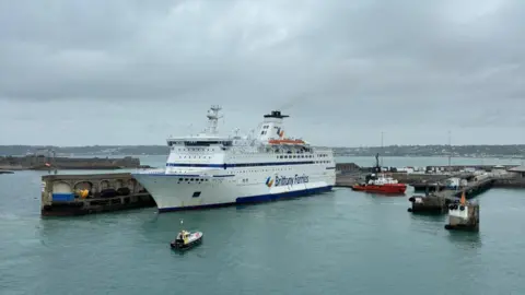 Ports of Jersey The Bretagne ferry docking at St Helier's harbour, surrounded by two smaller vessels