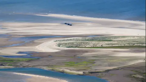 John Fielding Aerial Photography The SS Vina at low tide, showing the sea in the background, sandbanks and channels of water