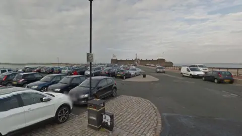 Google Cars parked in the Fort Perch Rock Car Park, with the River Mersey and Fort Perch Rock seen in the background.