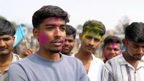 Prem Boominathan/BBC A group of first-time voters at Balen's rally, including 18-year-old Nandav Yadav