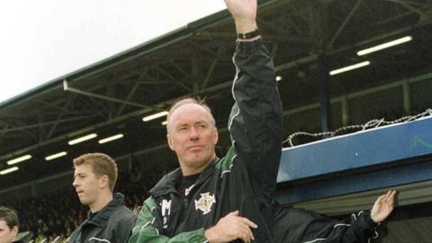 Sammy McIlroy waves to the crowd in Windsor Park