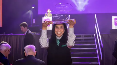 NCT Zohra Rani celebrating her win at the UK Bus Awards
