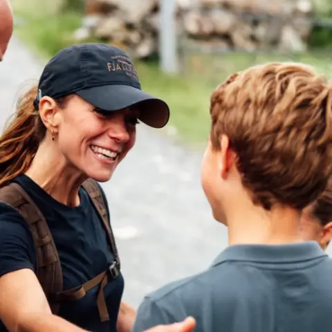Instagram/princeandprincessofwales Kate smiles at George who has his back to the camera as William looks on